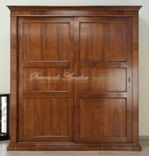 Armadi con ante scorrevoli in legno di noce : (Ros?) Armadi con ante scorrevoli in legno di noce : (Ros?)